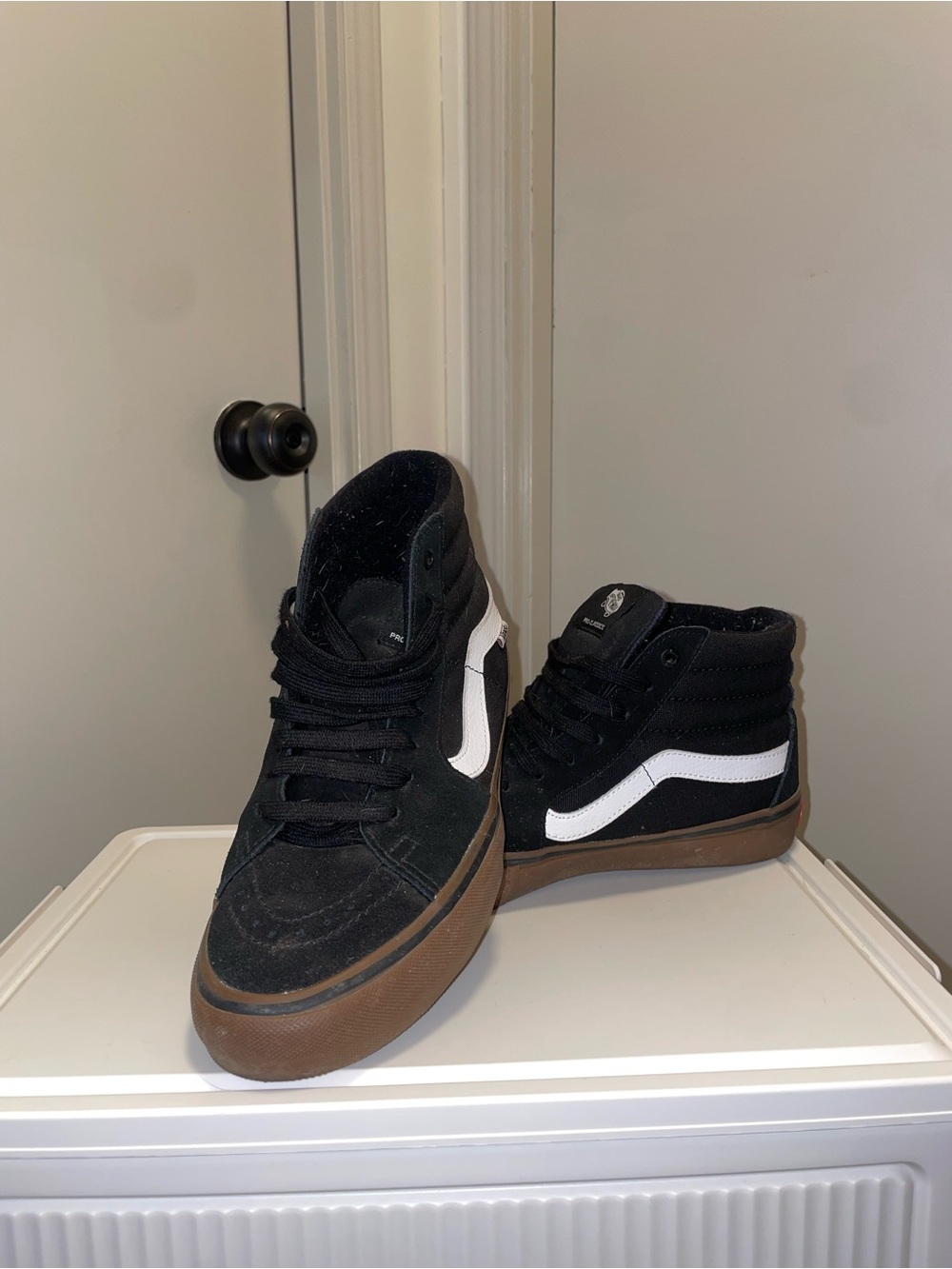 Vans Black High-Top Sneakers with White Stripe and Gum Sole